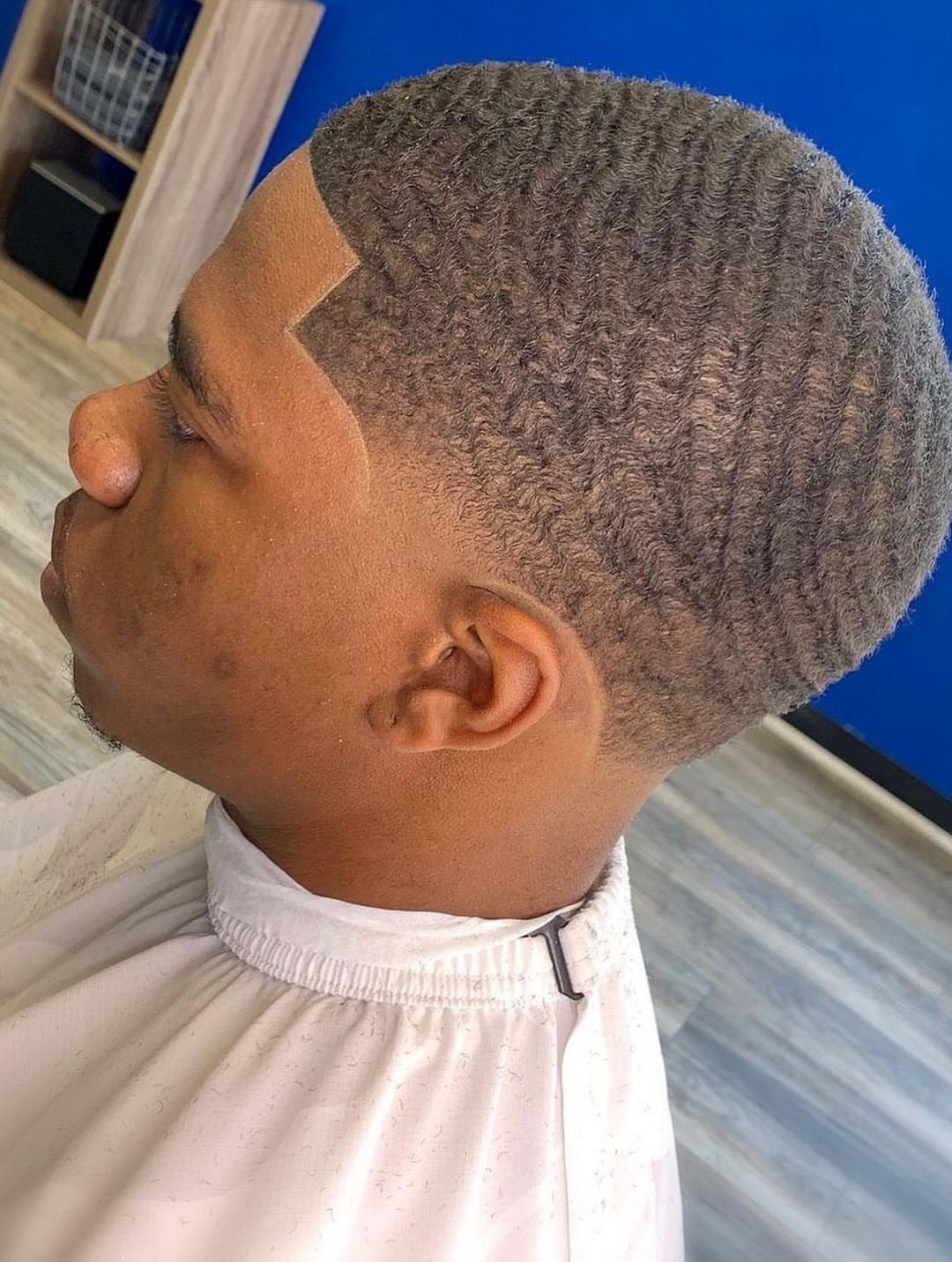 Man with 360 waves and a low temple taper fade haircut