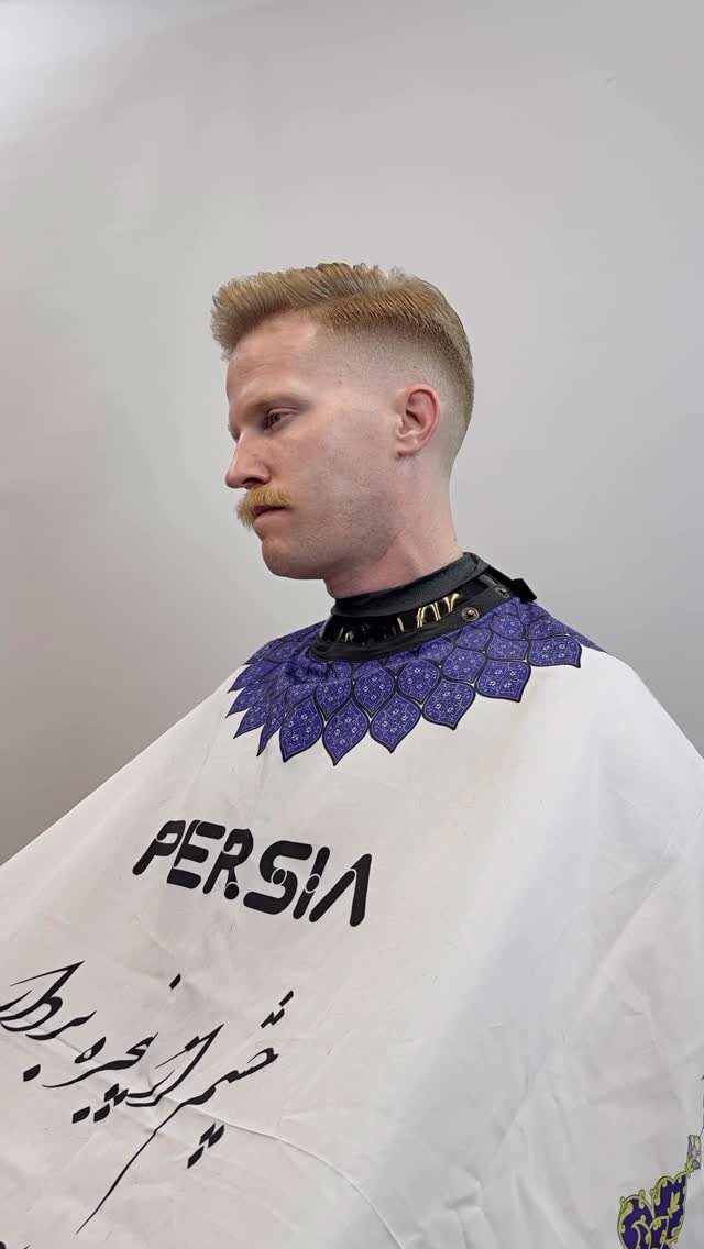 Man with blonde hair and mustache featuring a crew cut and side fade.
